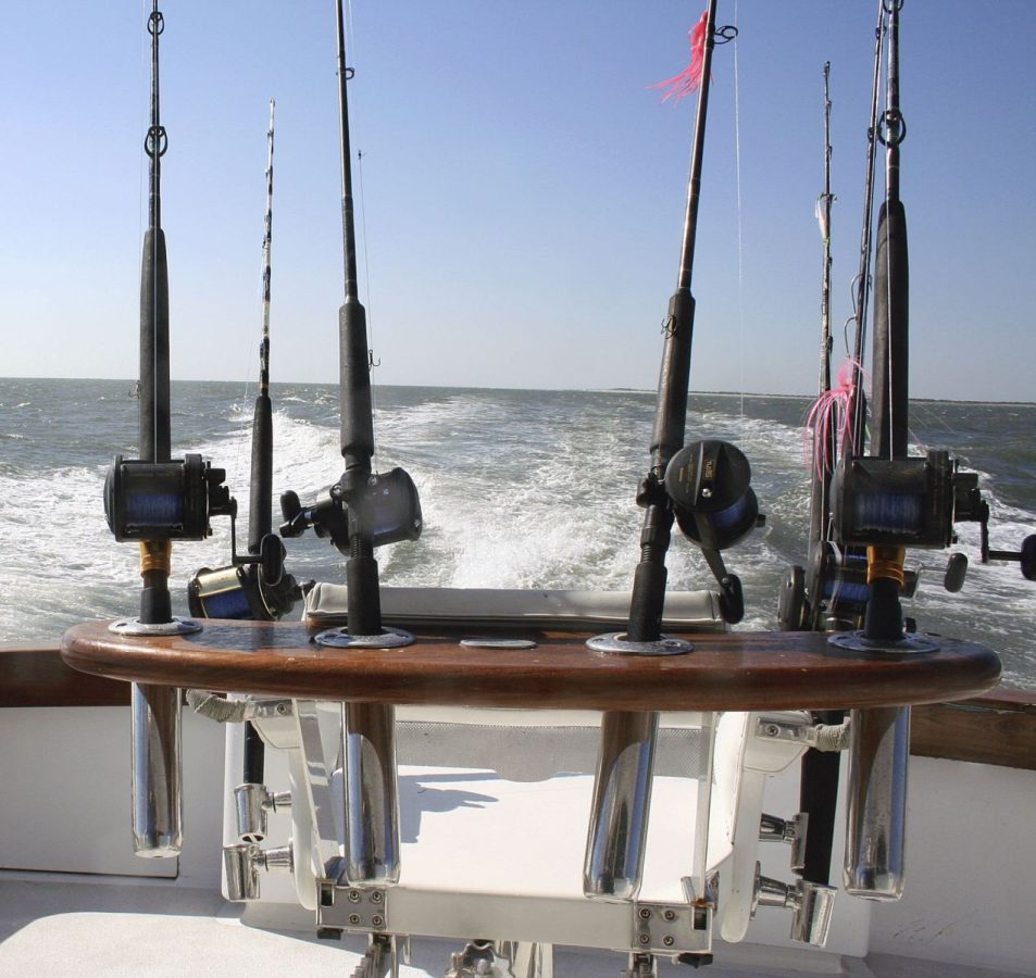Six fishing rods on moving boat